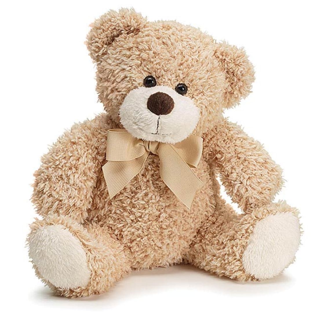 Plush teddy bear with a beige ribbon bow