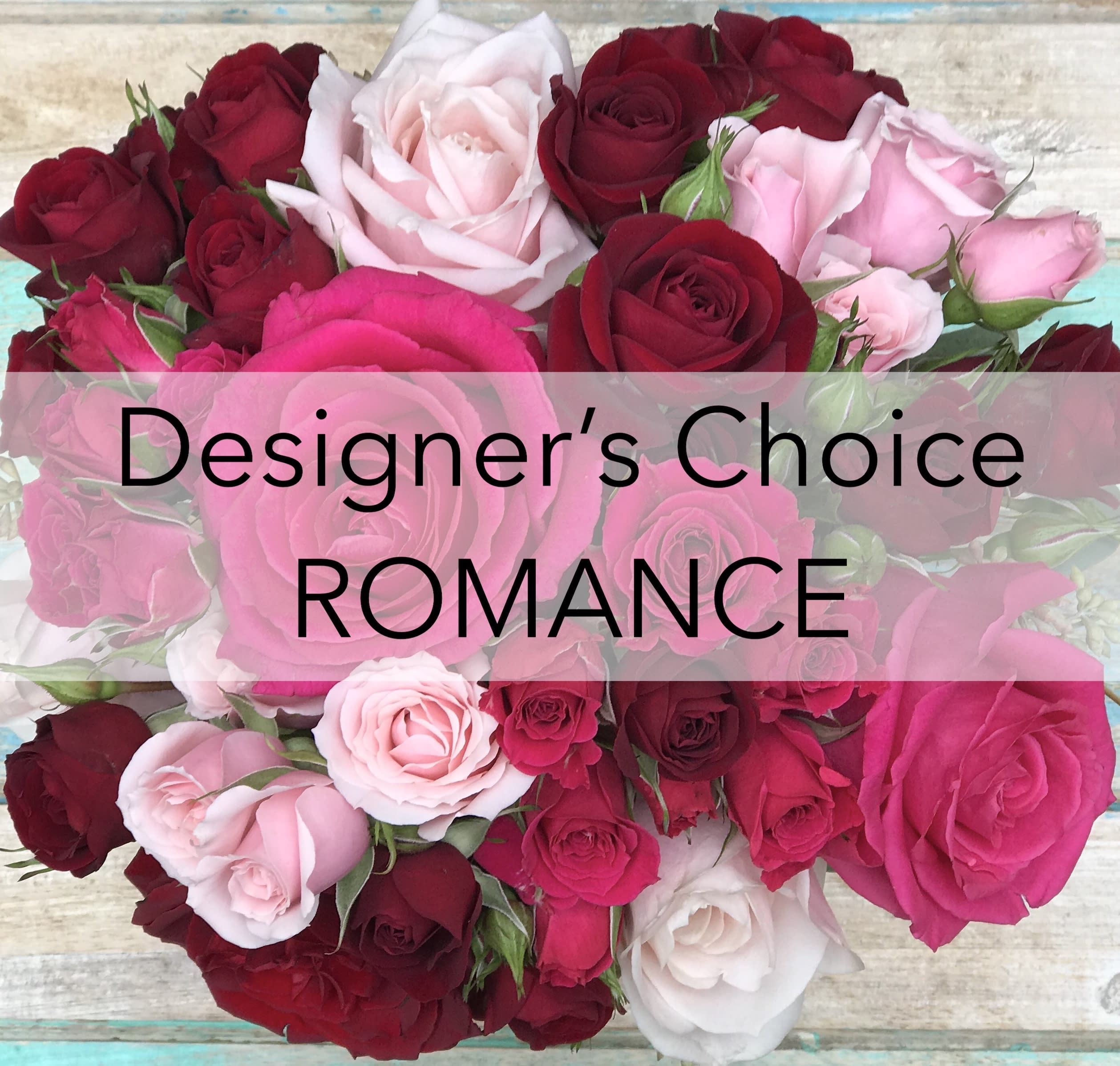Assorted pink, red, and white roses arranged in a bouquet