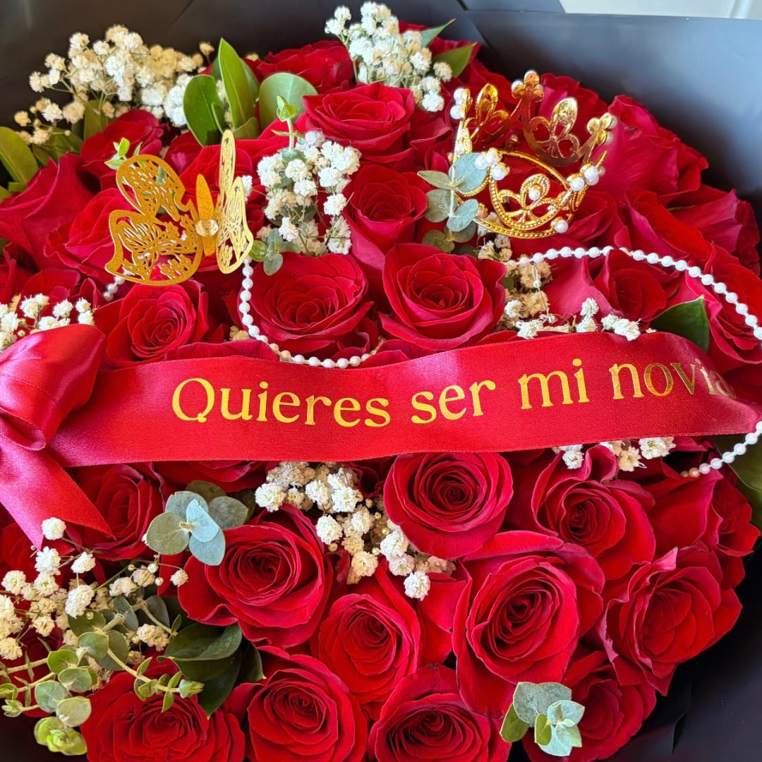 Red rose bouquet with a red ribbon and gold butterfly accents