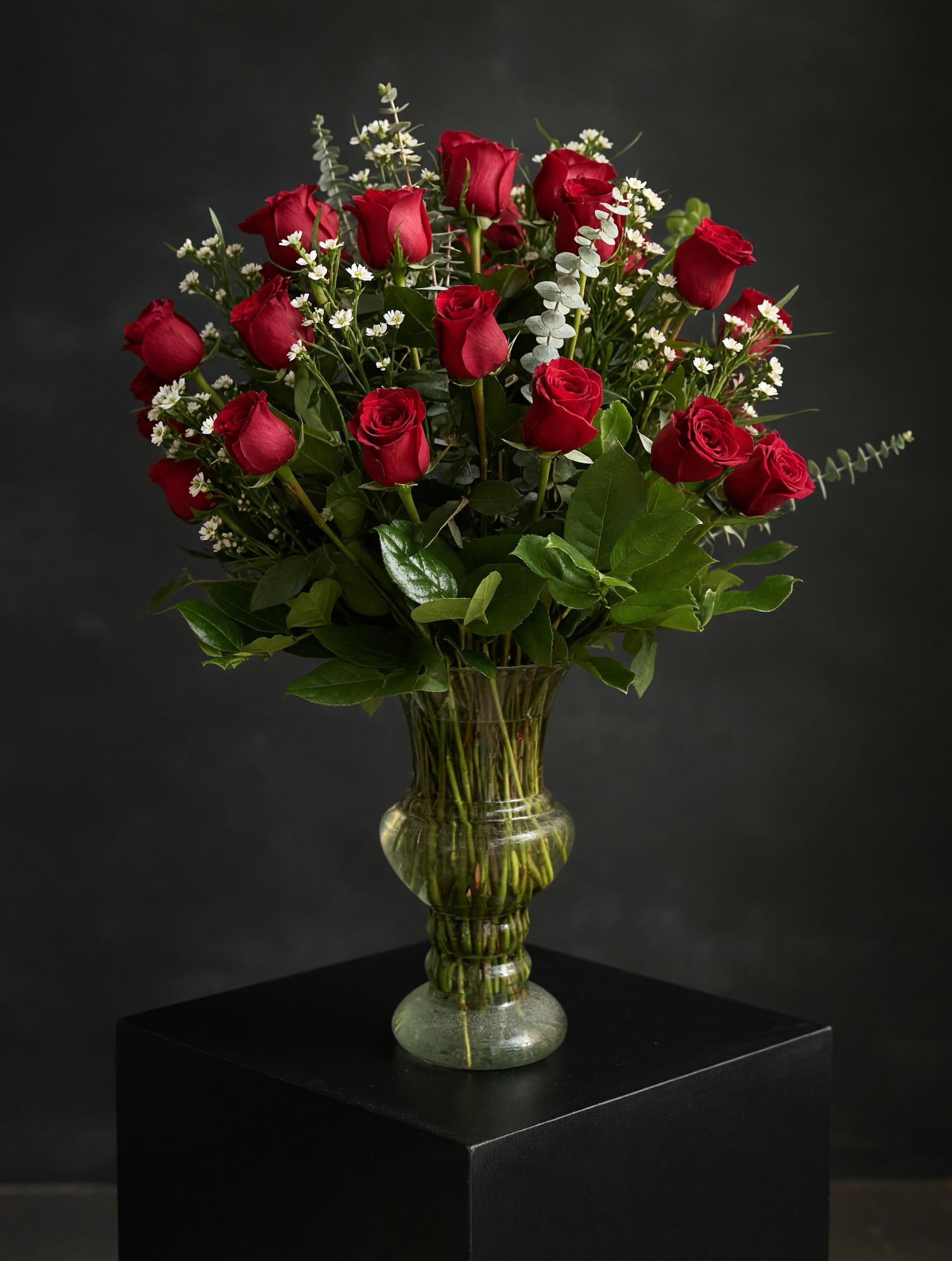 Amore Mio - This extra large arrangement is composed with four dozens of red roses and premium foliage. Delivery Recommended due to scale of this piece. Our arrangements are hand designed by our experienced floral designers.