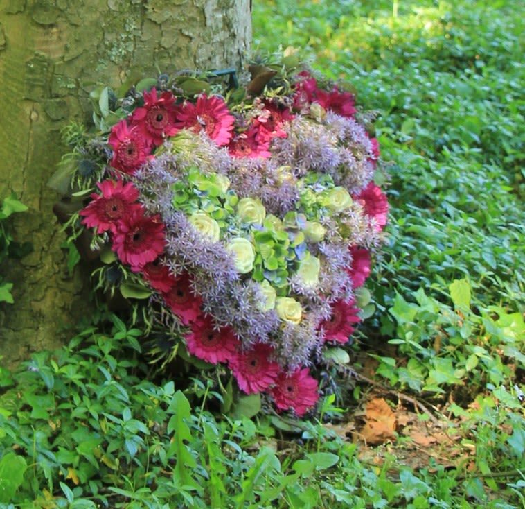 Solid Heart- (Custom Designs) - Petals &amp; Blooms Flowers will create a one of a kind custom, solid heart funeral wreath (stand/easel included) for your departed. Our talented staff of designer's understand the importance of saying "goodbye" to your loved one's. We will use the highest quality flowers in a unique style that will perfectly express your sentiment.  ***NOTE*** No flower requests accepted, nor design requests accepted for this product. Please send your color requests, up to 3 in the note to florist at checkout. 