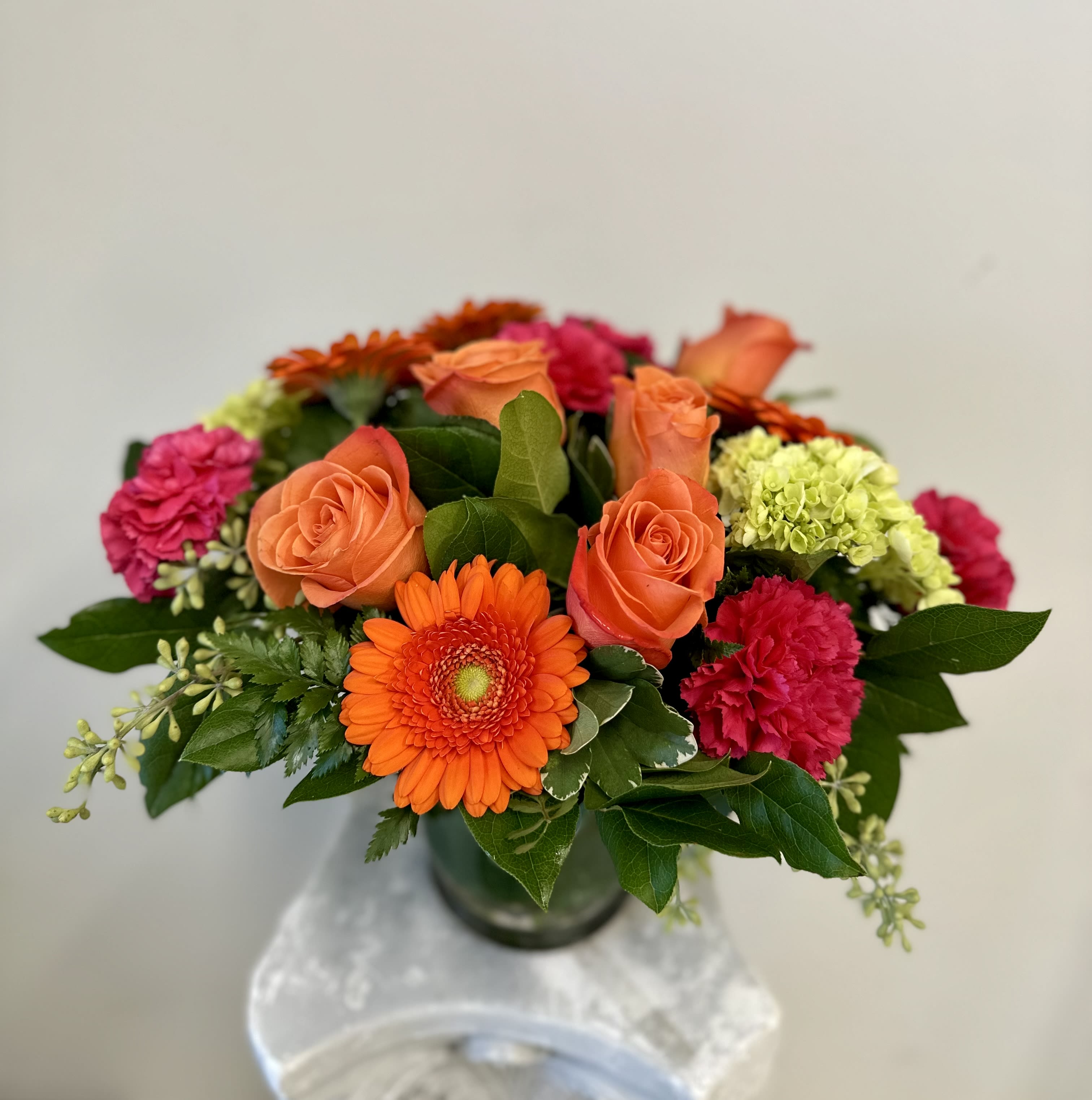 Wowy Zowy by Westford Florist Art by Veny - Elevate your space with the vibrant allure of the Wowy Zowy flower arrangement by Westford Florist Art by Veny. This modern bouquet is a stunning celebration of color, artfully combining bright orange, hot pink, and intense lime green blooms to create an eye-catching centerpiece that instantly enlivens any room. Crafted for those who appreciate bold aesthetics and floral elegance, the Wowy Zowy features exquisite roses alongside an array of fresh flowers designed to invigorate your décor. Whether it’s for your home or a thoughtful gift, this striking arrangement makes a statement that resonates with creativity and sophistication. Embrace the beauty of nature's palette with Wowy Zowy—where every bloom tells a vibrant story. Whether you're treating yourself or surprising someone special with this bouquet, the Wowy Zowy arrangement is guaranteed to make a statement. It's an excellent gift for birthdays, anniversaries, or just because! At Westford Florist, we take great pride in our floral creations. Our talented florists use only the freshest flowers available to ensure that every bouquet we create is of exceptional quality. We also understand that presentation is key when it comes to gifting flowers; that's why each Wowy Zowy arrangement comes beautifully wrapped in our signature packaging. So don't wait any longer - add some WOW to your day with the breathtaking Wowy Zowy flower arrangement by Westford Florist. Order now and get ready to be wowed!
