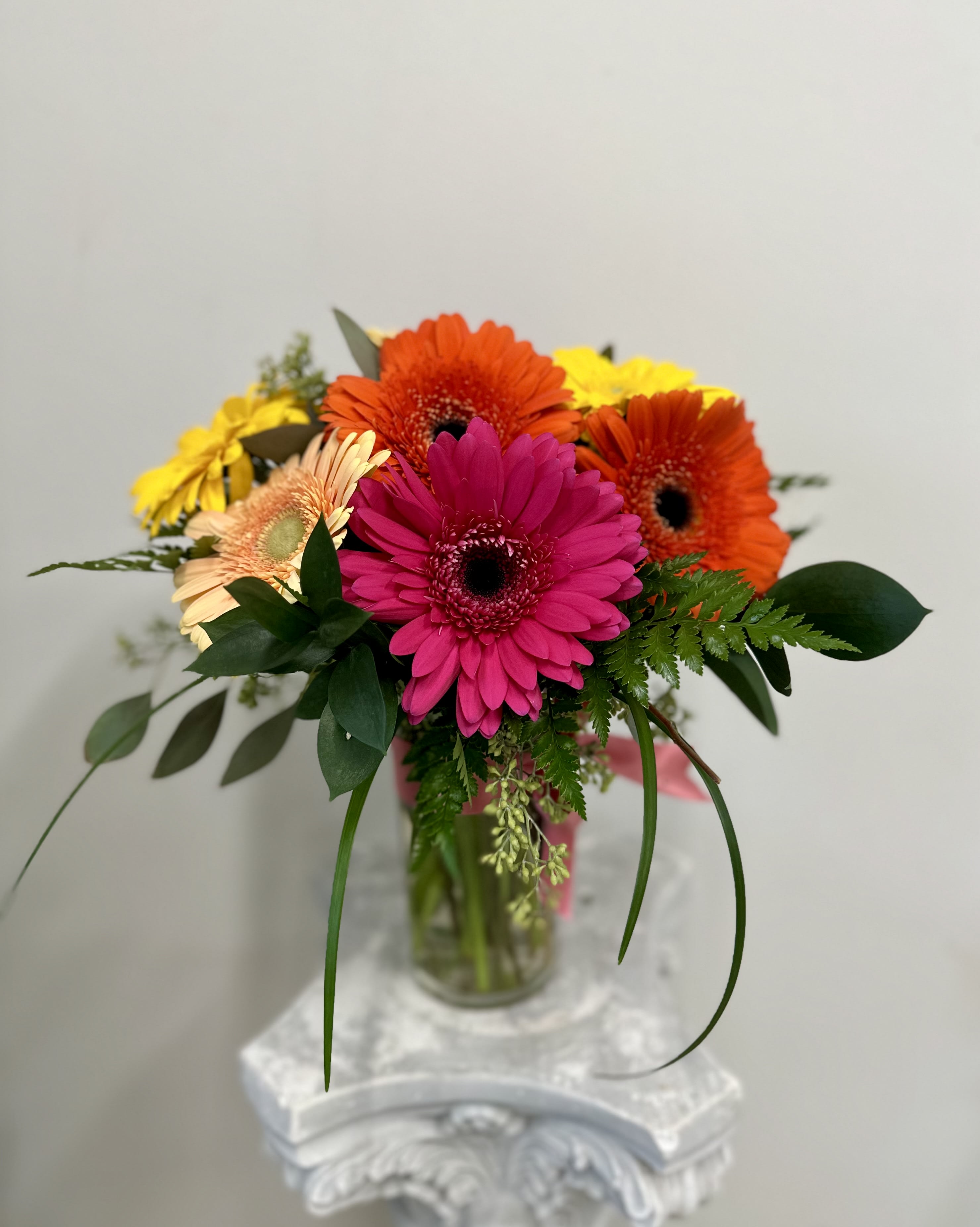 Happy Gerbera Daisies by Westford Florist Art by Veny - Our Happy Gerbera Daisies flower arrangement is the perfect choice for customers looking to add a touch of cheer and brightness to any occasion. Crafted by Westford Florist Art by Veny with vibrant Gerbera daisies thoughtfully arranged into a beautiful bouquet, this arrangement is sure to bring smiles and joy to all who receive it. Whether celebrating life's special moments or simply brightening up the day, our Happy Gerbera Daisies are guaranteed to make a lasting impression. Surprise your loved ones or treat yourself to this delightful display of color and beauty. Order your Happy Gerbera Daisies flower arrangement by Westford Florist today and spread happiness one bloom at a time.