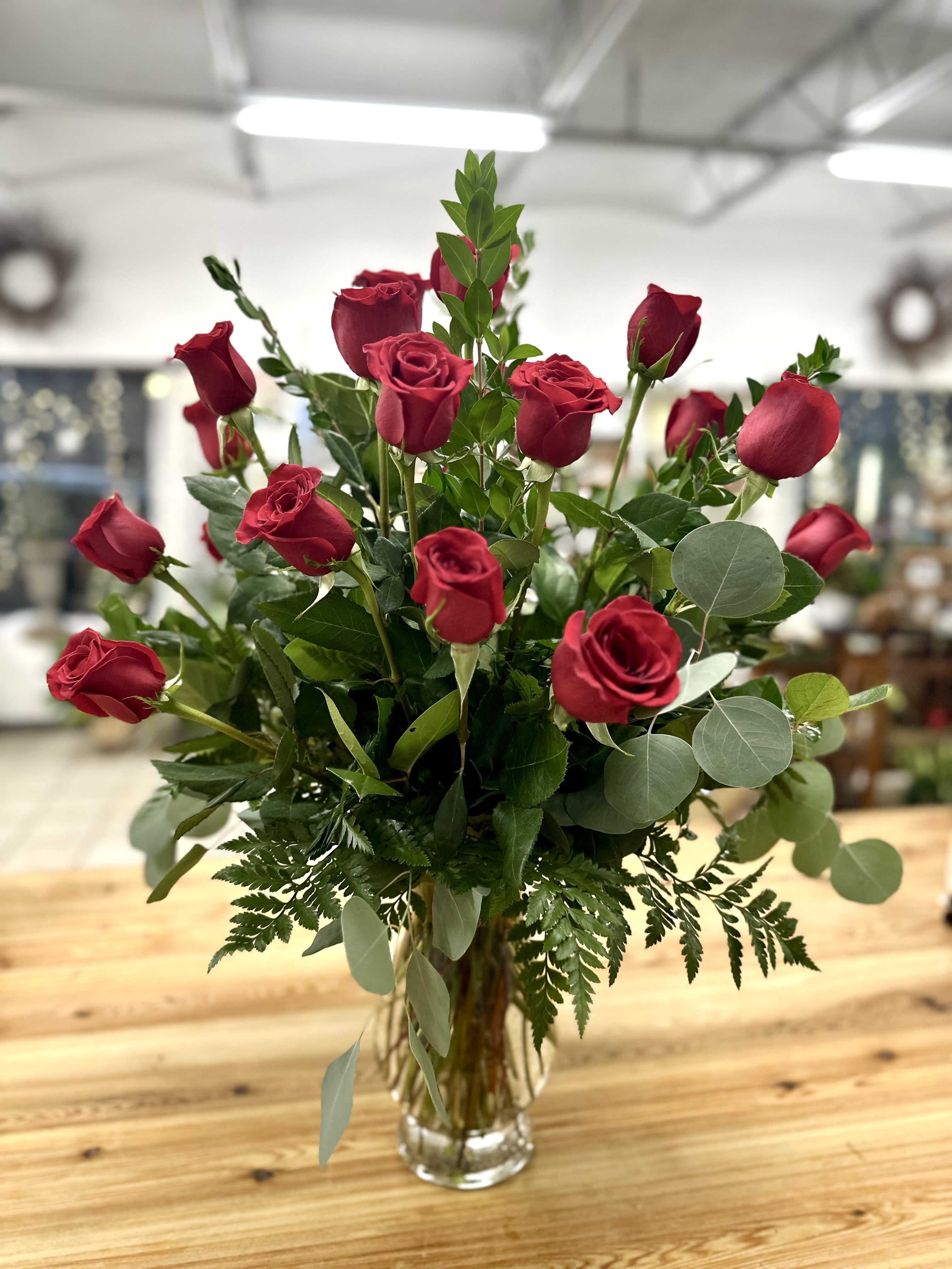 Two Dozen Long Stemmed Roses vase arrangement by Westford Florist Art by Veny - Wow your loved one with this stunning Two Dozen Long Stemmed Roses vase arrangement by Westford Florist Art by Veny! Bursting with romance and elegance, these bold red roses are sure to make a statement and leave a lasting impression. Perfect for any occasion, from birthdays to anniversaries or just because you want to show someone how much they mean to you. Say it with flowers by Westford Florist and let the beauty of these blooms do all the talking. Order yours today and watch love blossom before your eyes! APPROXIMATE DIMENSIONS: 30" H X 22" W