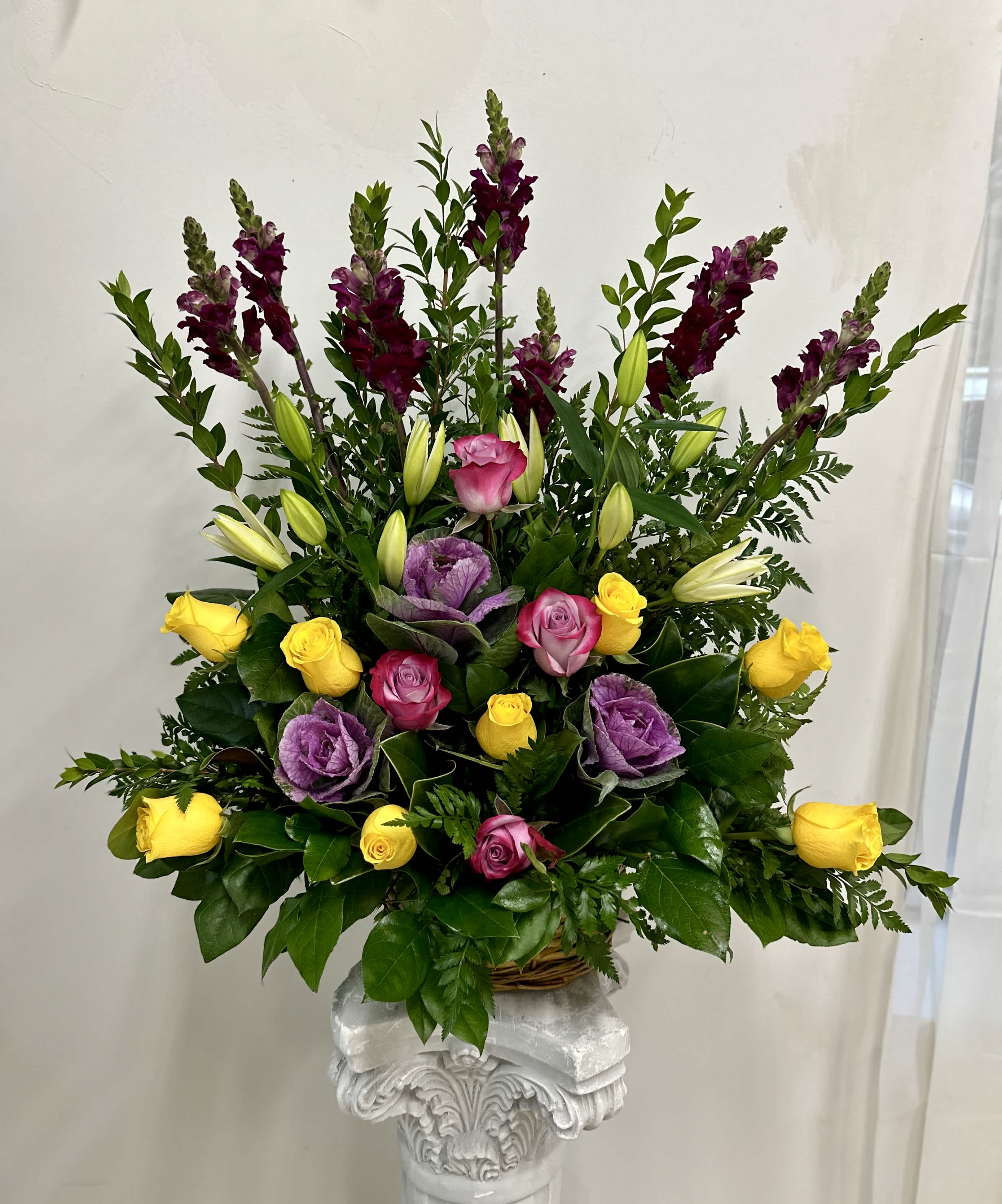 Strength and Silence by Westford Florist Art by Veny - In times of sorrow, finding the right words can be challenging. The Strength and Silence One Sided Basket Sympathy Arrangement by Westford Florist Art by Veny serves as a poignant tribute to honor the life of a cherished friend or loved one. This thoughtfully designed, one-sided arrangement features an uplifting array of vibrant blooms that convey heartfelt sympathies with grace and elegance. Each detail is crafted to provide comfort and solace during difficult moments, allowing you to express your compassion without uttering a single word. Offer your sincere condolences and celebrate their memory with this exquisite floral tribute that speaks volumes in silence. It's one-sided design allows for easy placement against walls or on tables without obstructing views or conversation among guests. Each stem is carefully selected and arranged by our skilled florists at Westford Florist with meticulous attention to detail. Losing someone dear to us can leave an indescribable void in our hearts. Yet through this gesture of sending the Strength and Silence Basket Sympathy Arrangement by Westford Florist, you are paying tribute not only to their life but also acknowledging the significance of their presence in our lives. Express your unwavering support and sympathy to those who are grieving with this heartfelt arrangement that speaks volumes without uttering a single word.