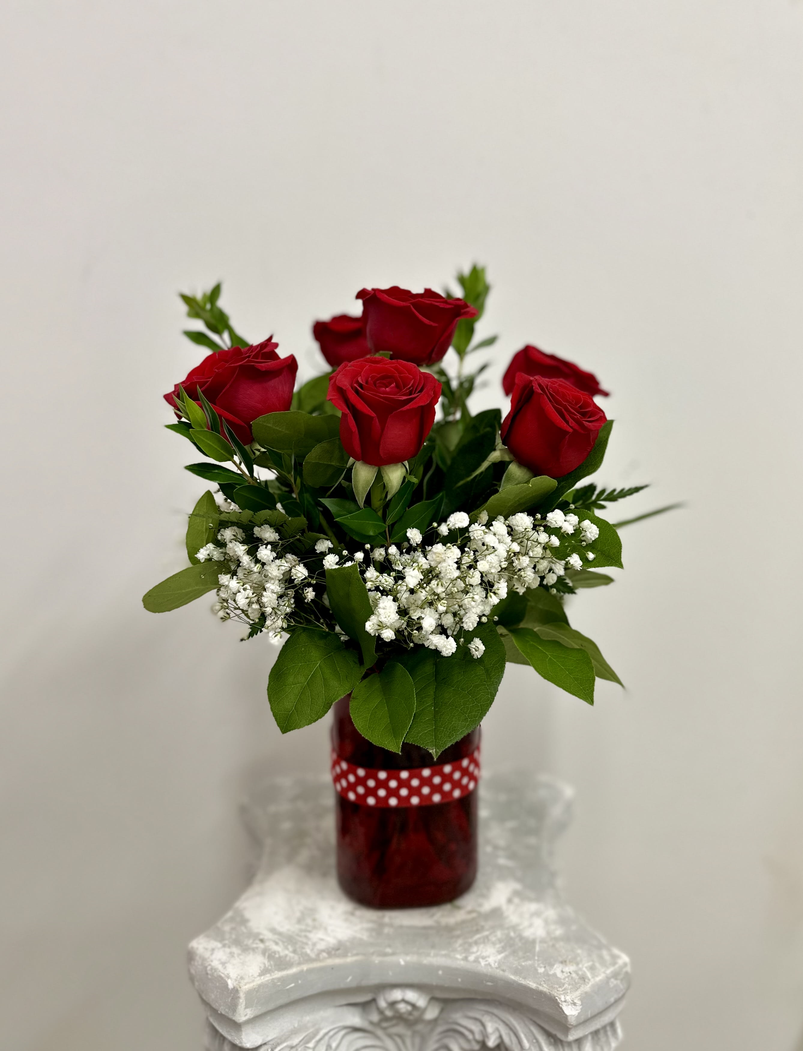 Simply Red by Westford Florist Art by Veny - Elevate your expressions of affection with the Simply Red arrangement by Westford Florist Art, crafted by Veny. This exquisite design features six vibrant red roses elegantly intertwined with delicate baby's breath, embodying a perfect balance of sophistication and simplicity. Whether celebrating a special occasion or simply wishing to brighten someone's day, this bouquet conveys heartfelt emotions in an effortlessly chic manner. Show your love beautifully; let Simply Red be the quintessential symbol of your sentiments.