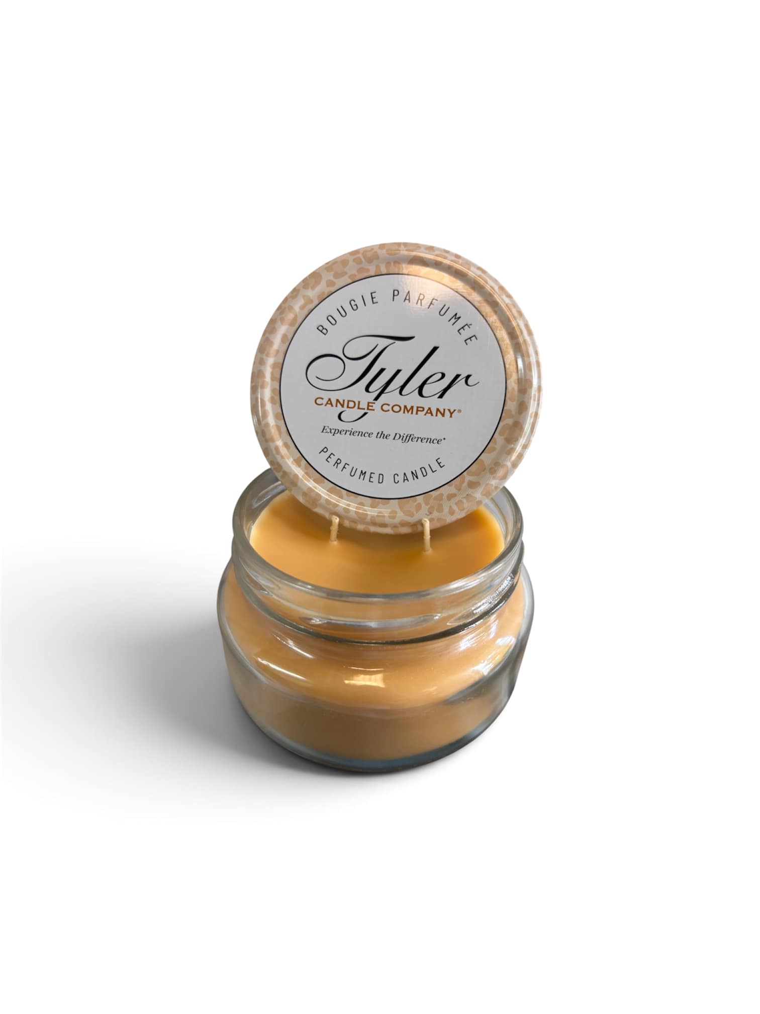 Jar candle with a round lid labeled Tyler Candle Company
