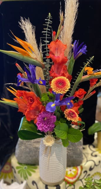 Hawaiian Punch - An explosion of stunning tropical flowers like Birds of Paradise and Wild Ginger will be artfully arranged in this premium contemporary vase.  Tropical flowers are the perfect gift for the vibrant, full-of-life special person in your life.  Now is a great time to order them!