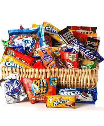 Basket filled with assorted snack-size candy and cookie packages