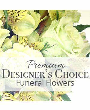 Yellow and white funeral flower arrangement with lilies and alstroemeria