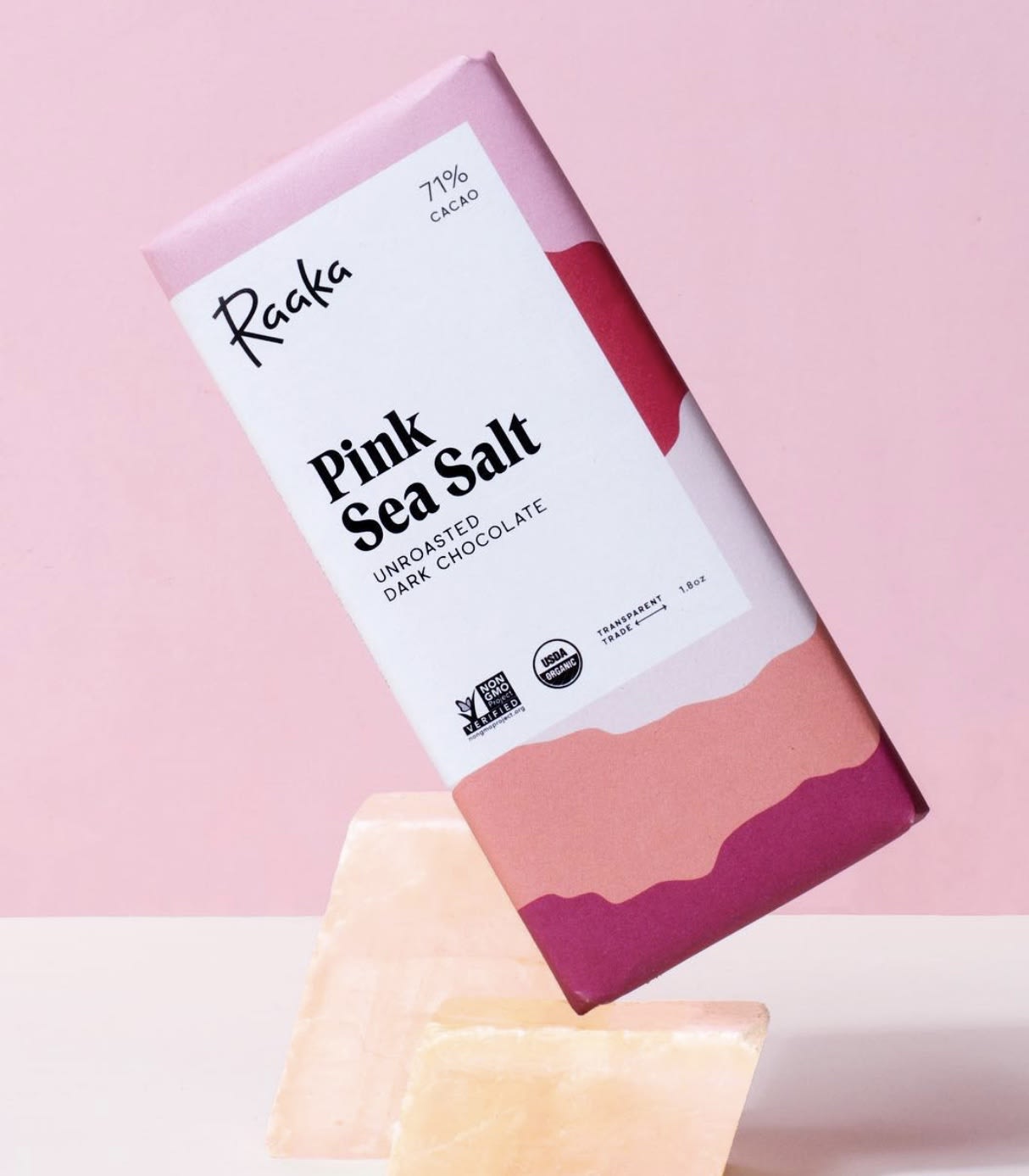 Pink sea salt dark chocolate bar on a pink background