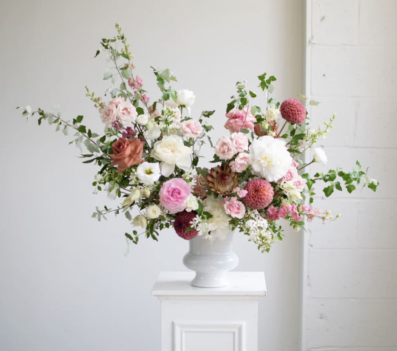 Sympathy Urn Arrangement  - A stunning Arrangement designed in a large urn. This is a popular arrangement for a funeral service. Please call us to customize your color palette. 