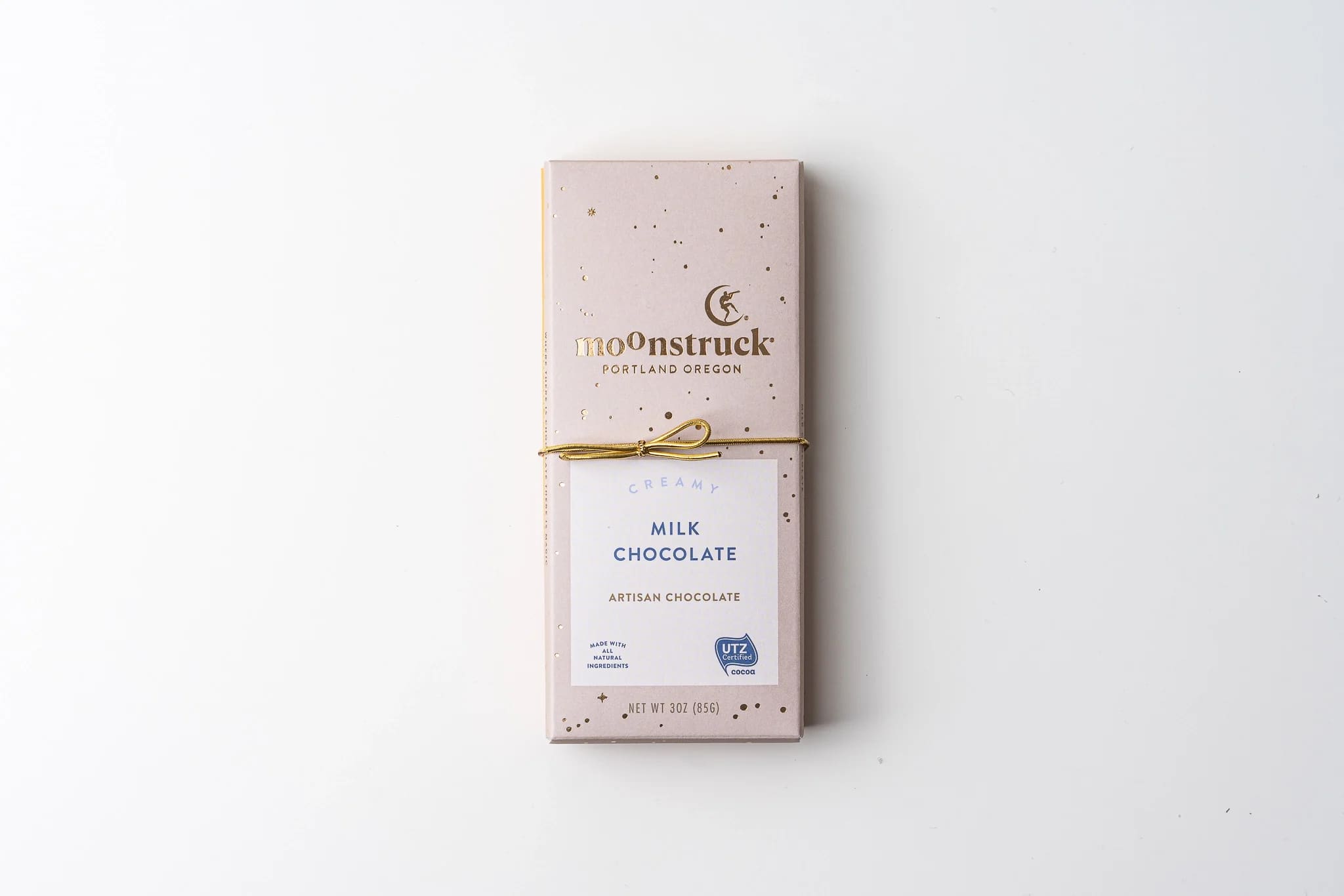 Box of milk chocolate tied with a gold ribbon