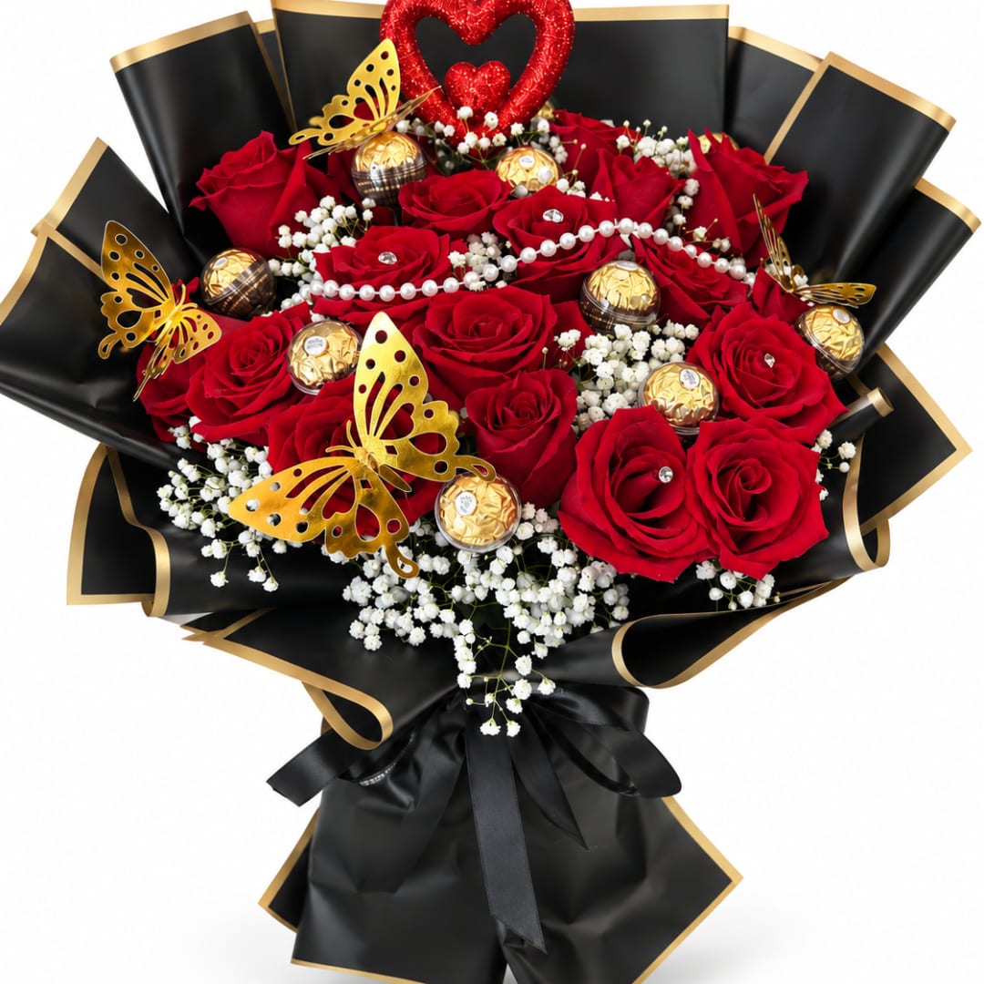Bouquet of red roses with white baby's breath, gold chocolates, and butterfly accents