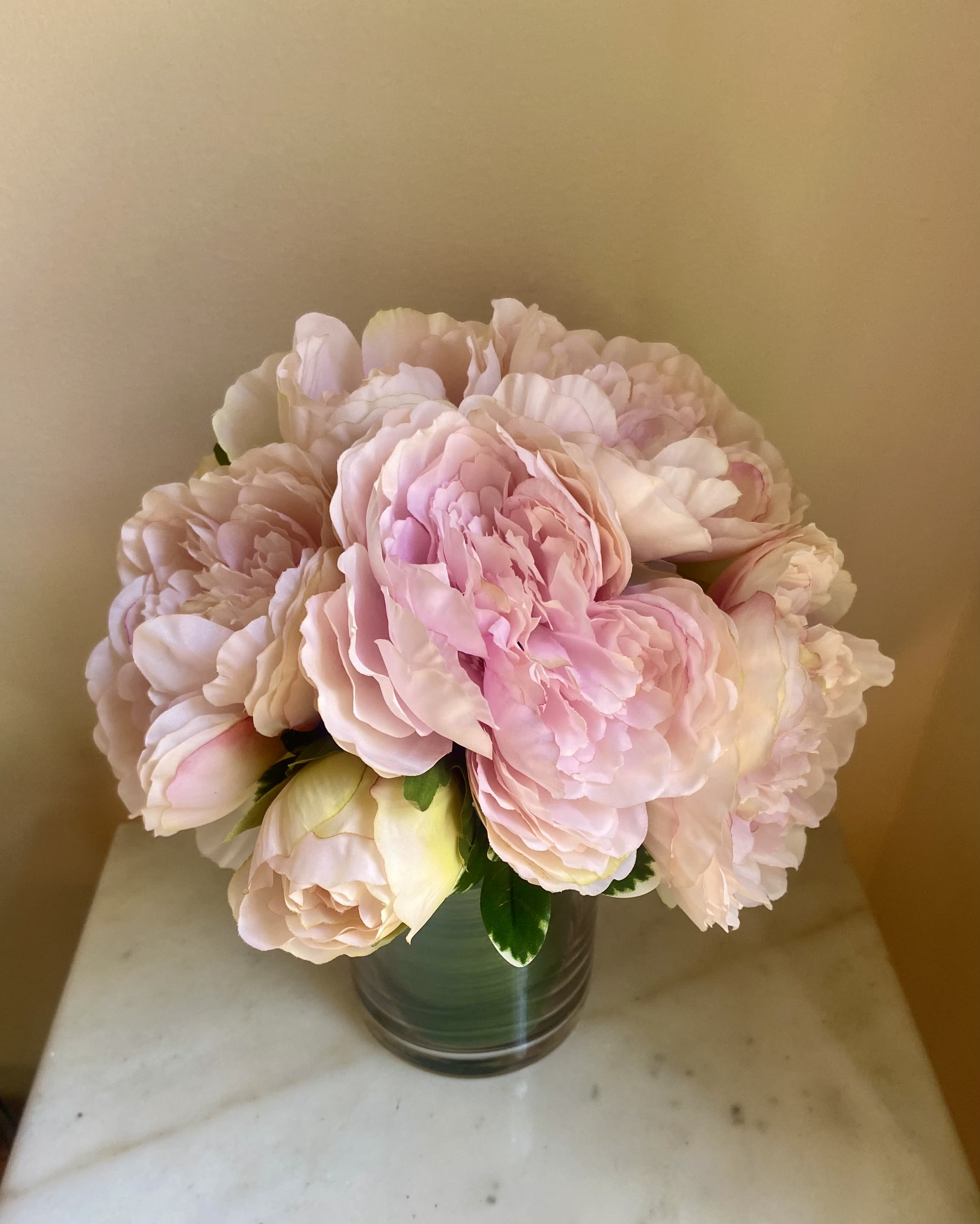 Love Peonies - Silk Floral Arrangement - Peony favorite.  Arrangement of 10 pale pink silk peonies in a clear glass vase with a foliage wrap.  Look so real and will last forever! 