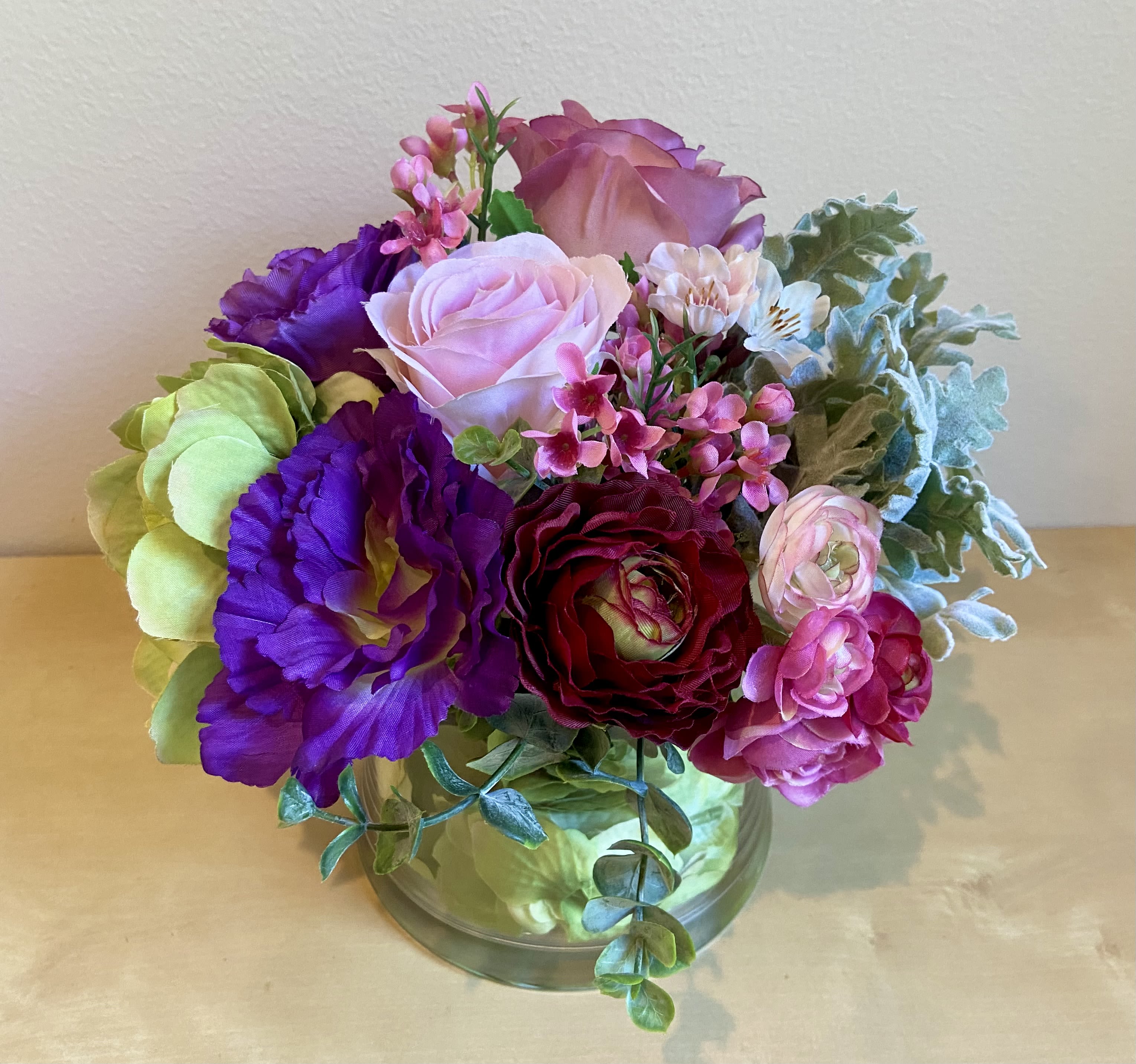Vibrant Posy - Silk floral Arrangement - Petite posy of silk flowers in vibrant hues.  Lisianthus, ranunculus, roses, hydrangea &amp; wax flowers clustered together. 10” tall &amp; wide.
