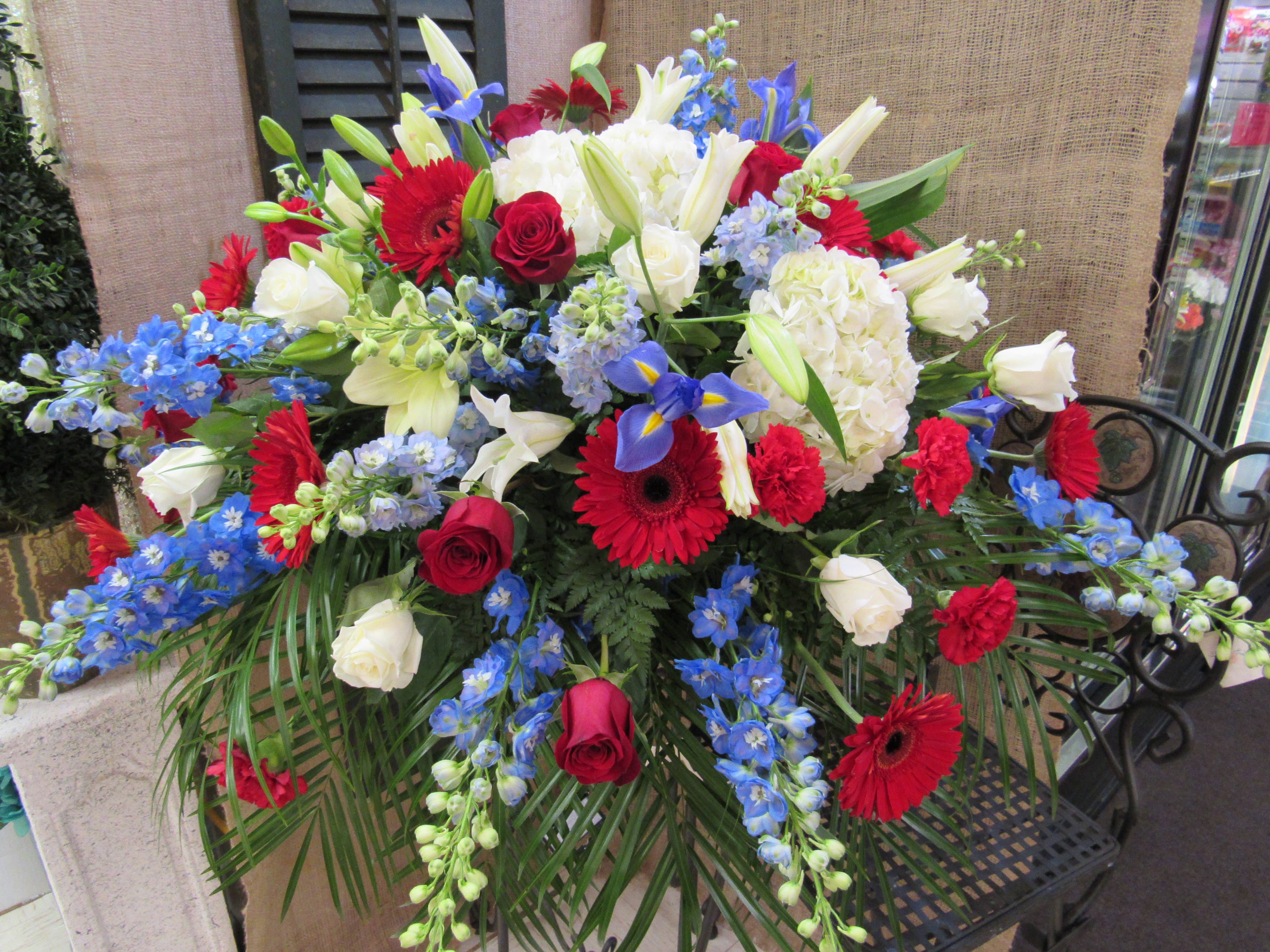 Large mixed bouquet with red, white, and blue flowers