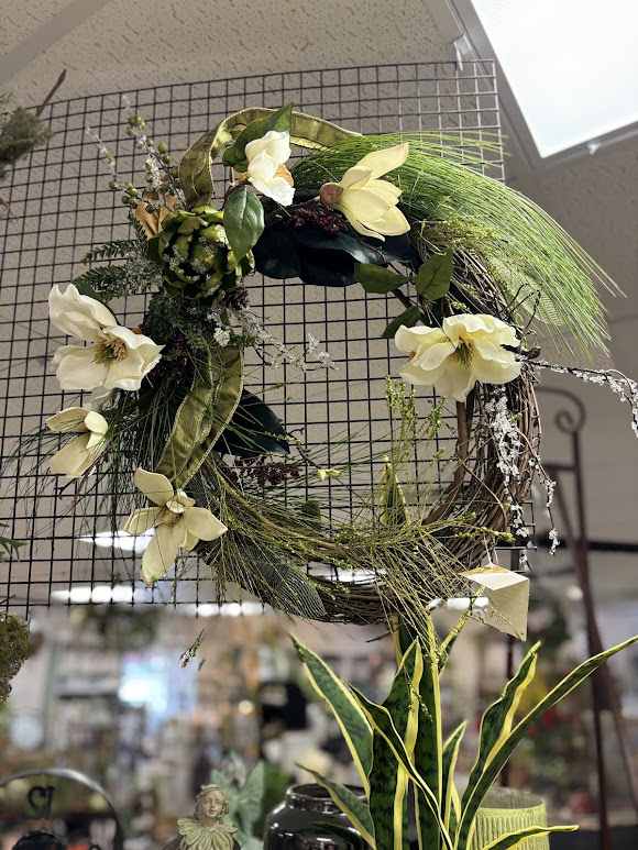 Floral wreath with pale cream flowers and long green grasses