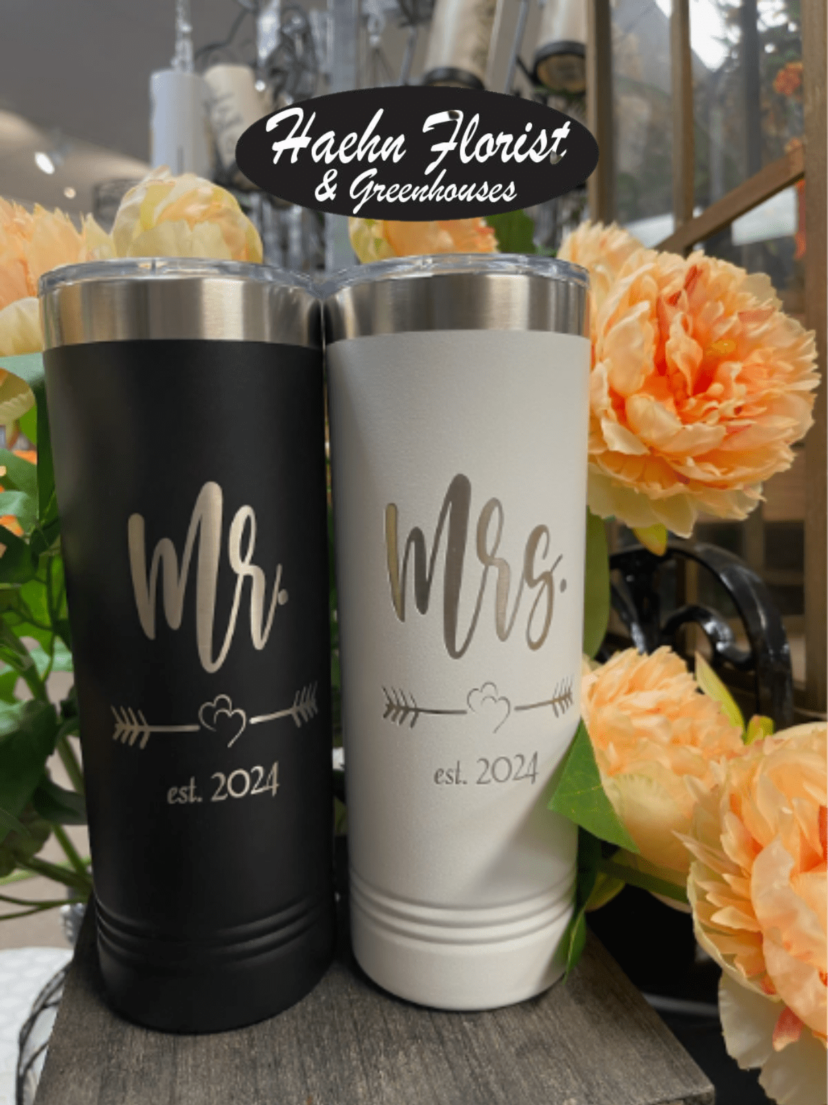 Two engraved tumblers with Mr. and Mrs. text beside peach flowers