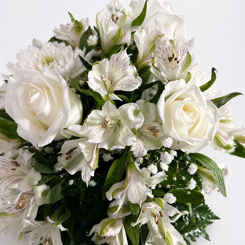 White roses and alstroemeria arranged in a bouquet