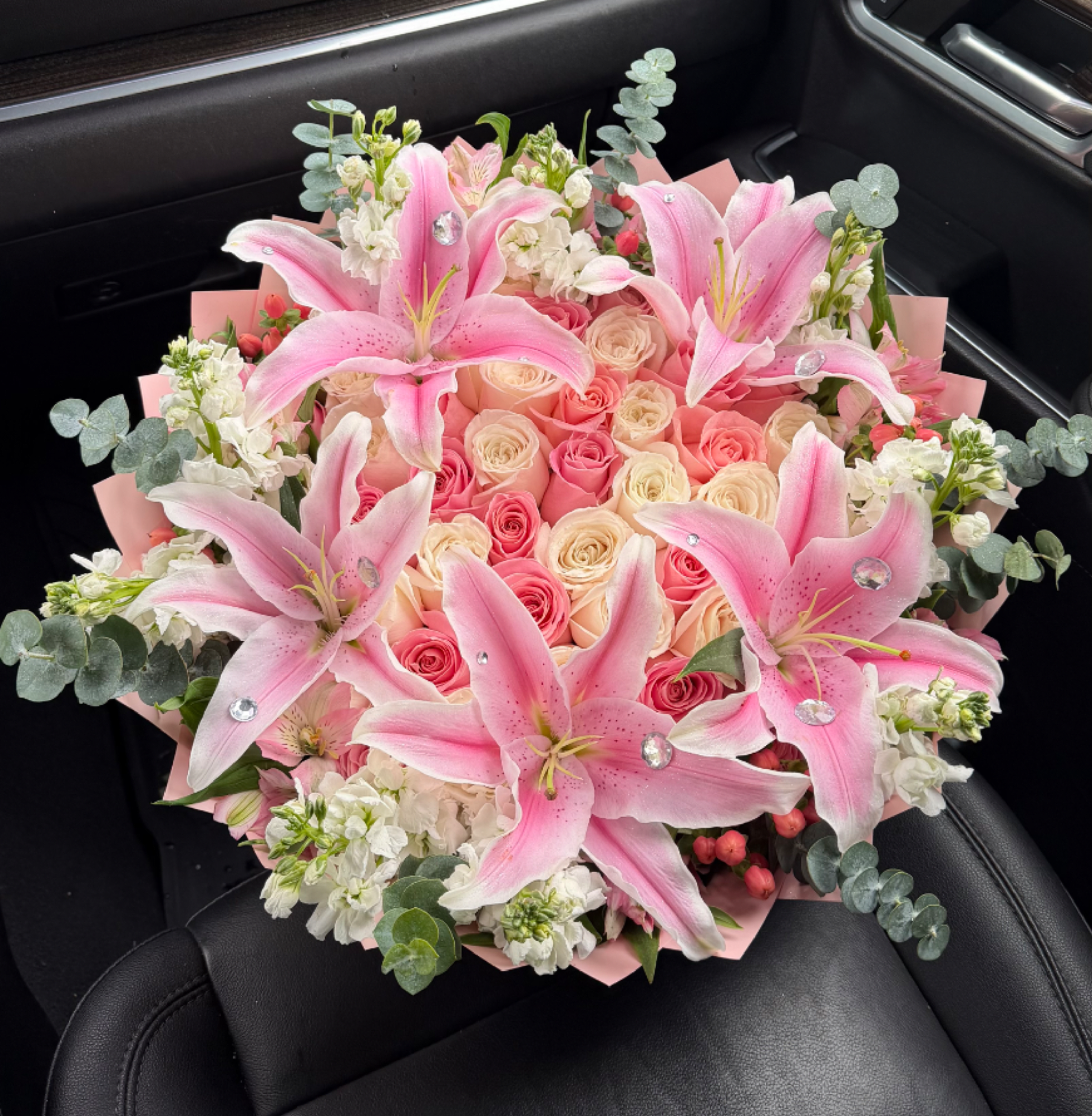 MOST WANTED - 50 count with Mix Bloom Rim . Topped with lilies 