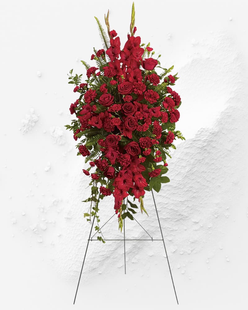 Tall red floral standing spray on an easel