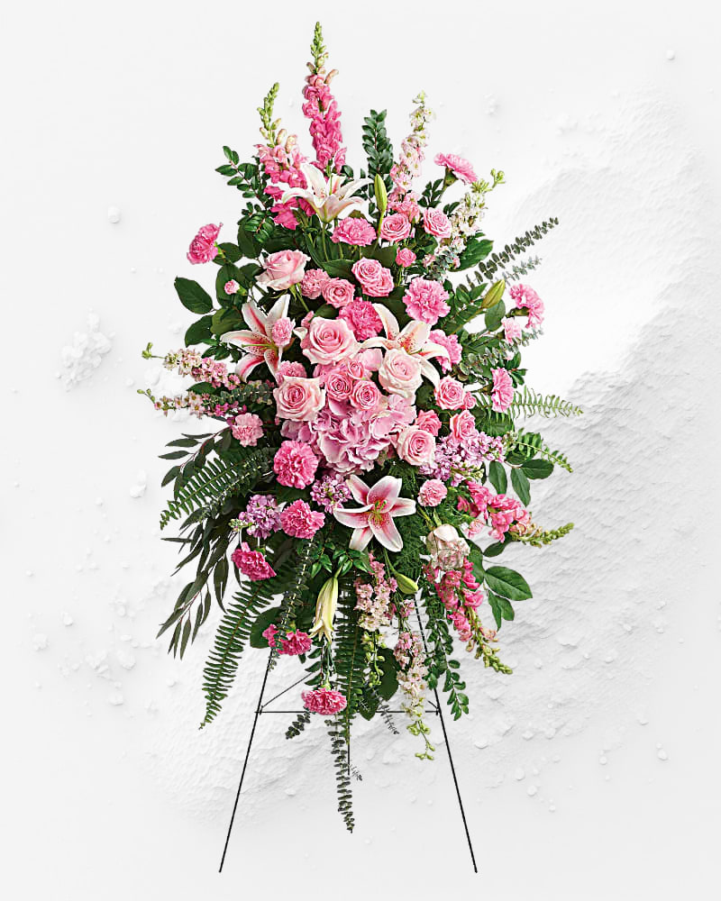 Tall pink floral standing spray on an easel