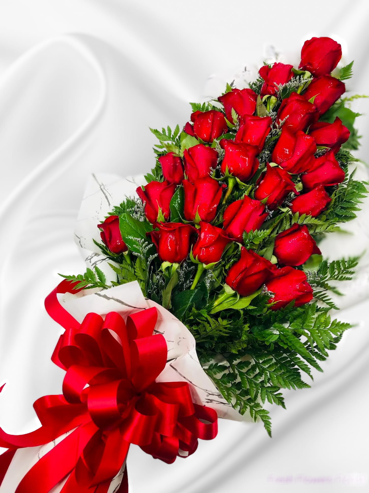 Bouquet of red roses with a red ribbon bow