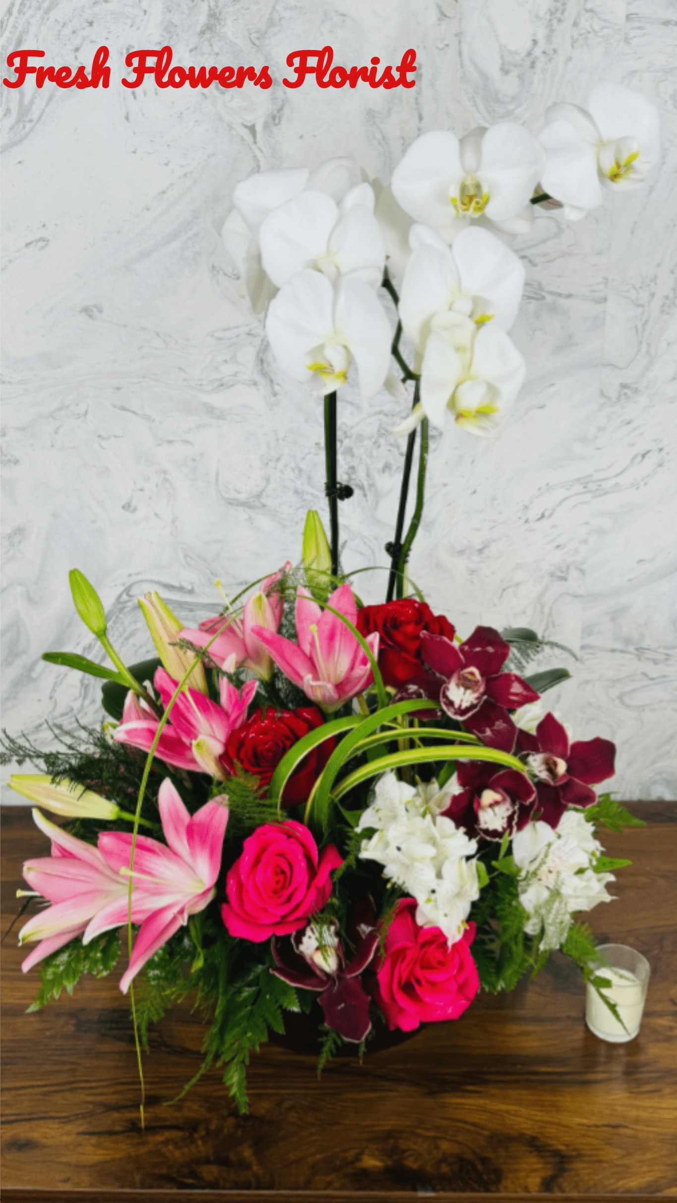 Everlasting Orchid - **Everlasting Orchid**: This unique arrangement features a vibrant orchid plant paired with fresh cut flowers, creating a stunning display. Once the cut flowers have completed their life cycle, the recipient can cherish the enduring beauty of the orchid. This thoughtful gift symbolizes lasting elegance and the joy of nature, making it a perfect addition to any home or office. Enjoy the beauty of the orchid long after the blooms fade, as it continues to thrive and flourish with care.perfect for anniversaries, birthdays, Father's Day, get well, graduations or just because thank you , I'm sorry , Mother's Day,Valentine's Day, funeral 