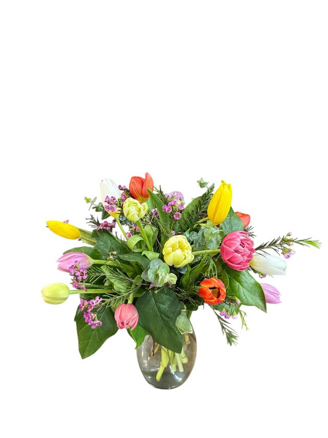 Colorful tulip bouquet in a clear glass vase