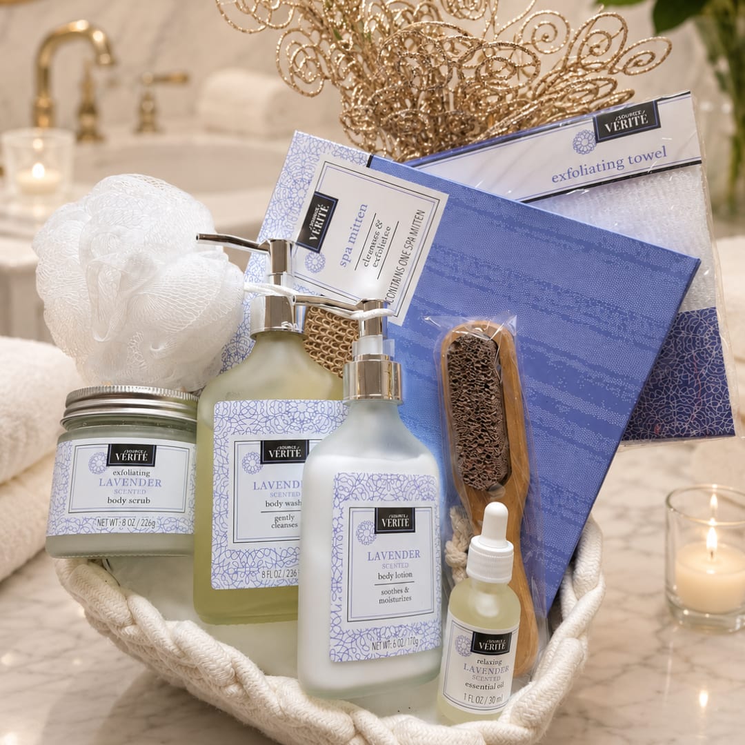 Lavender spa gift basket with body care items, towels, and candles