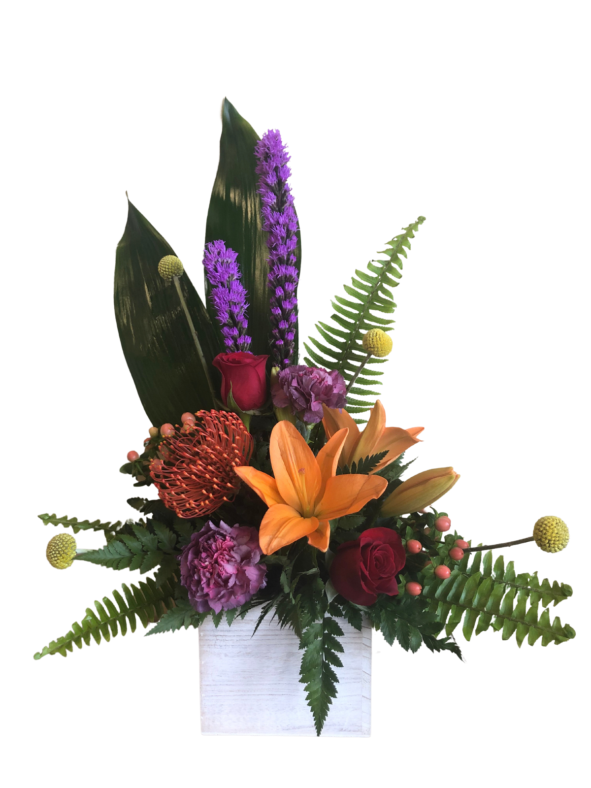 Tropical floral arrangement with orange lily, red roses, and purple blooms in a white box
