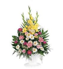 Tall mixed flower arrangement with yellow, pink, and white blooms