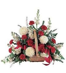 Basket arrangement of red and white carnations