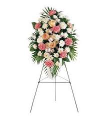 Standing floral spray with pink and white flowers on an easel