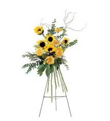 Tall sunflower arrangement on a metal stand