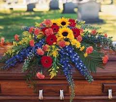 Colorful floral spray arranged on a casket