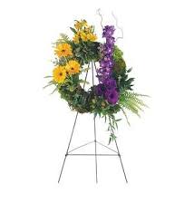 Floral wreath on a standing easel with yellow and purple flowers