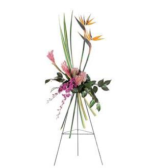 Tall tropical floral arrangement on a metal easel with pink and orange blooms