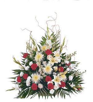Large floral arrangement with red, white, and yellow flowers
