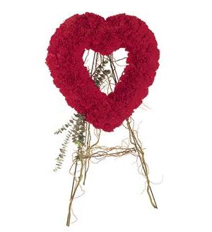 Red floral heart-shaped wreath on a twig stand