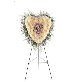 Heart-shaped floral standing spray on an easel