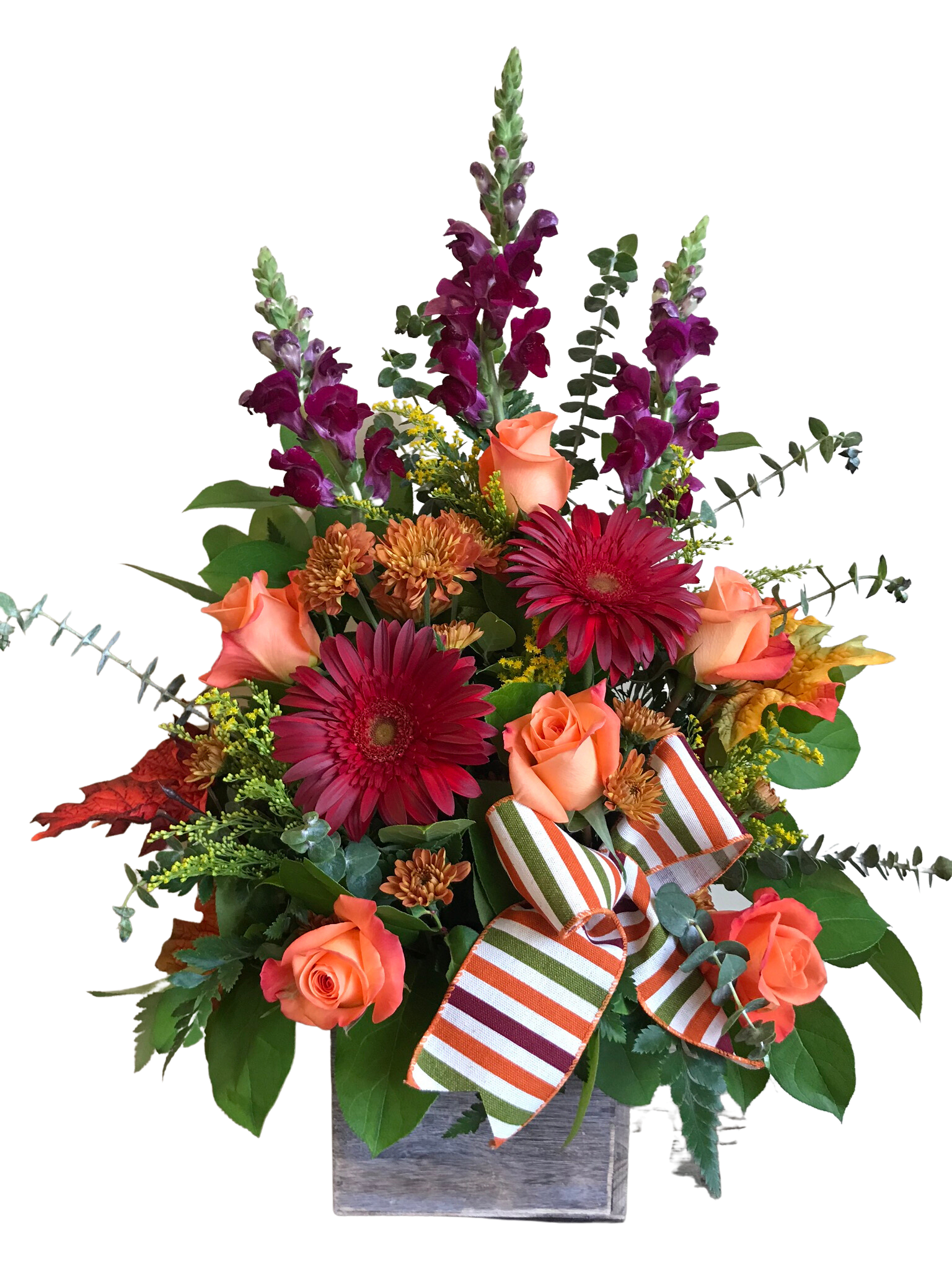 Bouquet of orange roses, red gerberas, and purple snapdragons in a wooden box