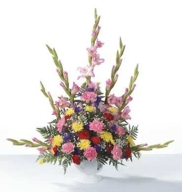 Colorful mixed flower arrangement in a white vase