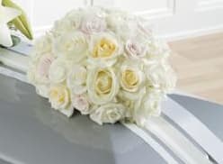 White rose bouquet with pale yellow centers