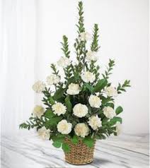 White carnation arrangement in a woven basket