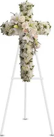 White floral cross on a stand