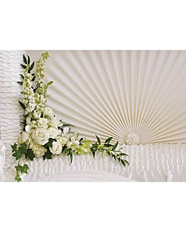 White floral spray arranged in a fan shape with greenery