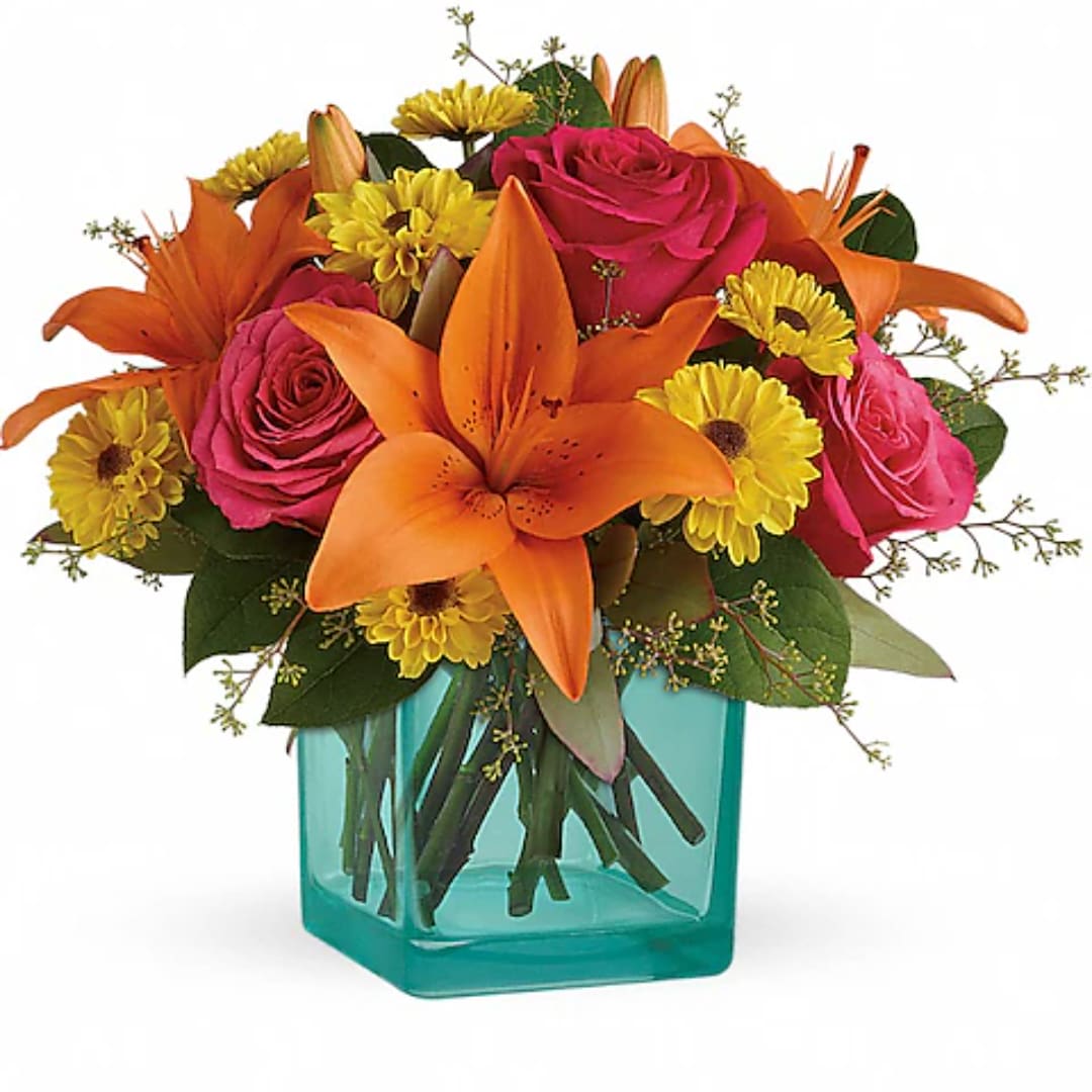 Orange lilies, pink roses, and yellow daisies in a turquoise vase