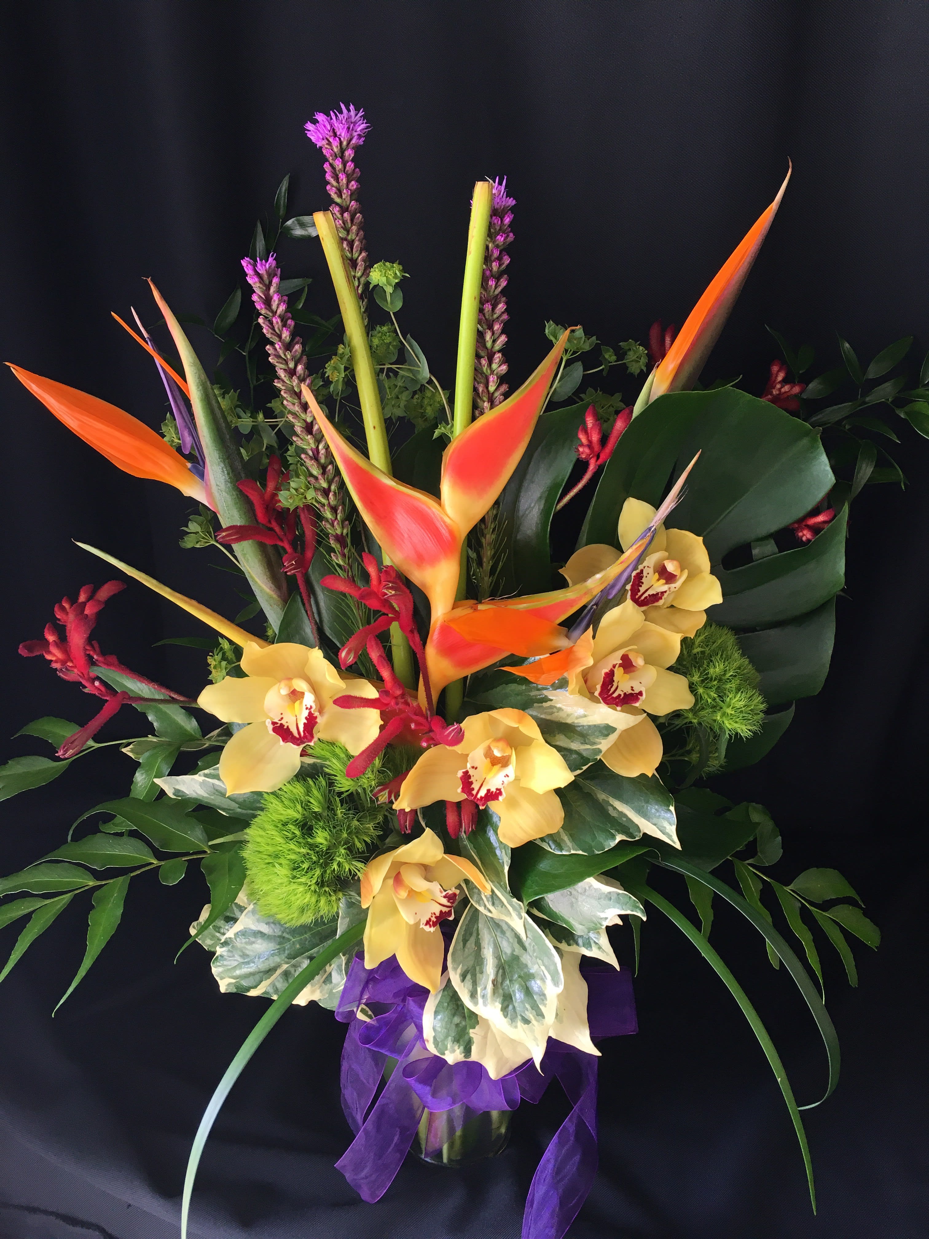 Exotic Tropical Tall Mix - Let us WOW you with a Vibrant display of both Exotic and Tropical flowers from around the globe! Flowers and colors will vary but will include a diverse assortment sure to please. ALWAYS order Tropical exotic flowers well in advance; we suggest a 2 WEEK notice for closest possible match.  3 weeks prior to Mother's day or Valentine's day
